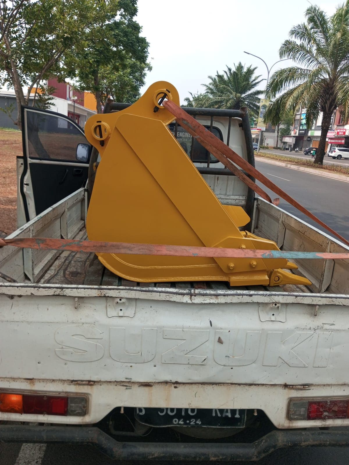 A finished bucket strapped to a truck for delivery